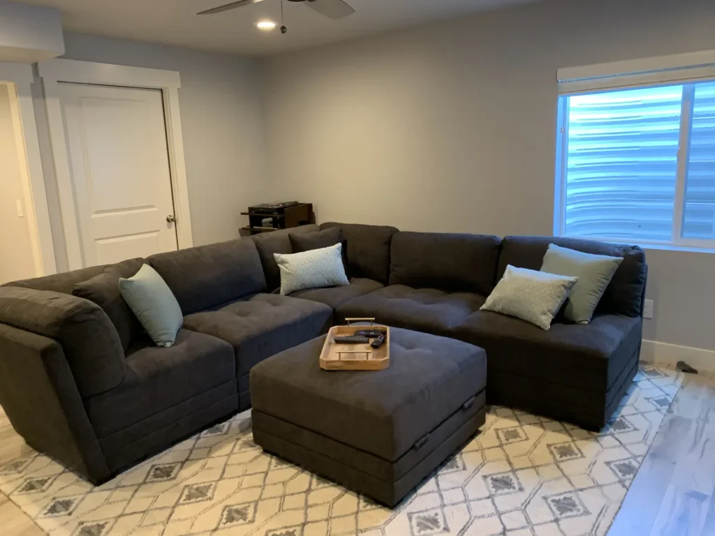 Herriman Utah Basement Finishing- a cozy family room with a large couch