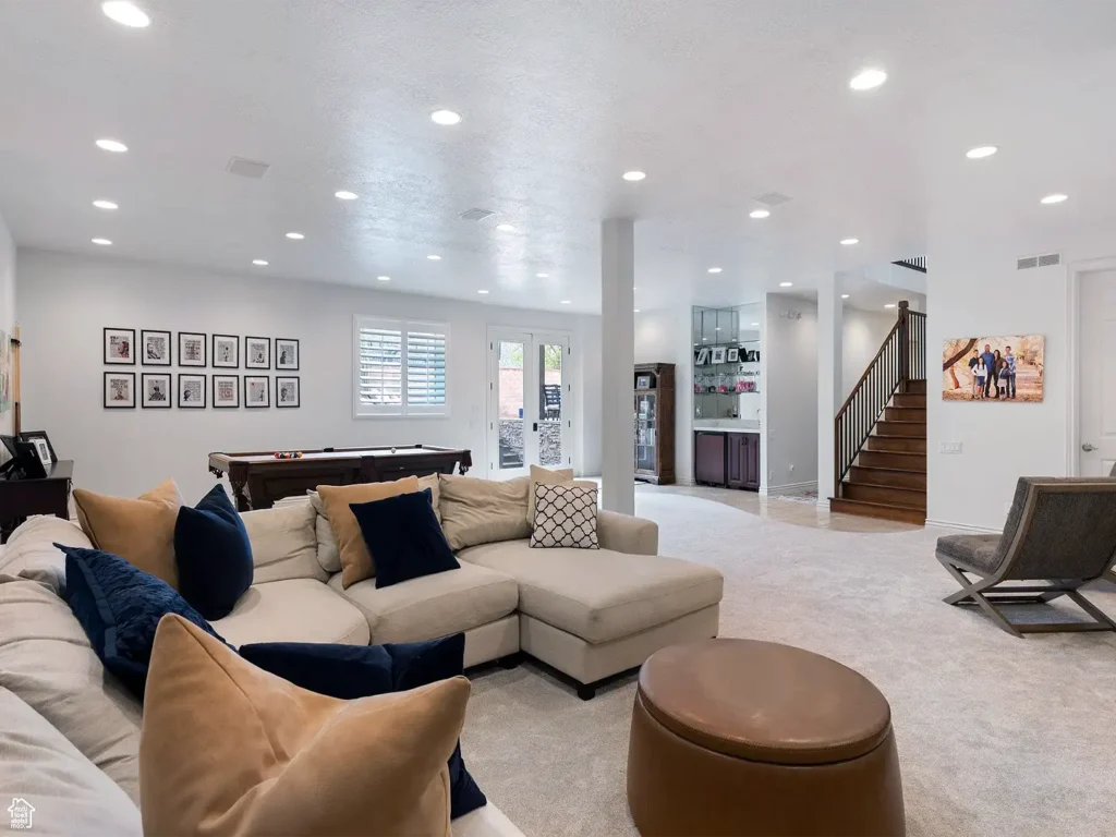 Bright finished basement living room with modern seating and open layout