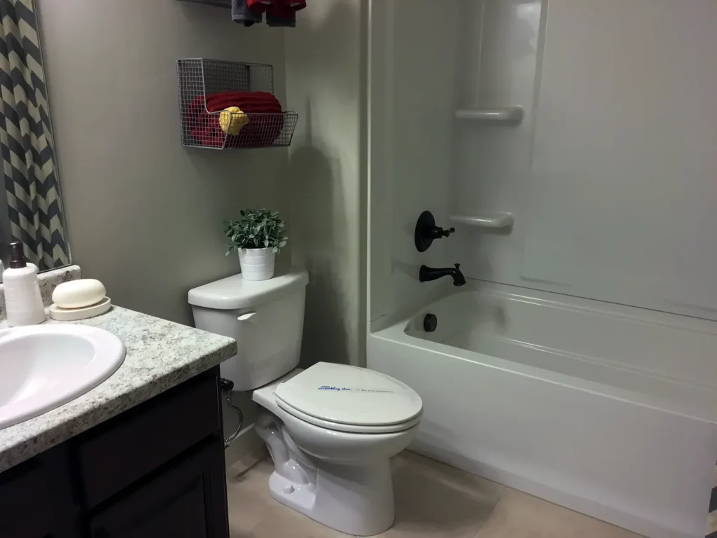 Herriman Utah Basement Finishing- bathroom with a standard tub-shower combo and toilet