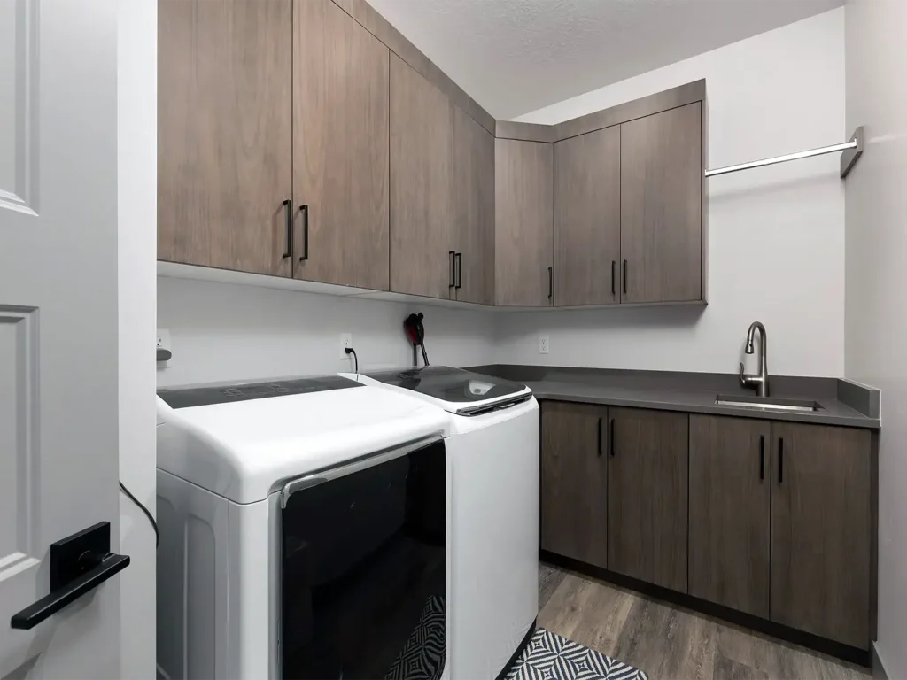 Saratoga Springs Basement Finishing- custom laundry room with cabinets