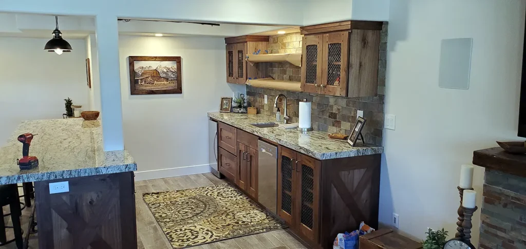 Saratoga Basement Finishing- kitchenette with wood cabinets and granite countertops