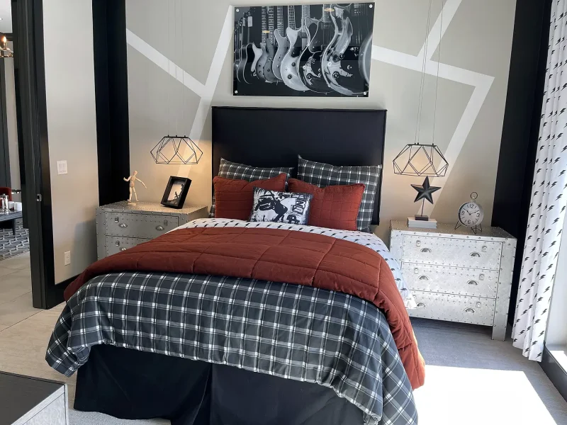 basement bedroom with bed nightstands and modern decor
