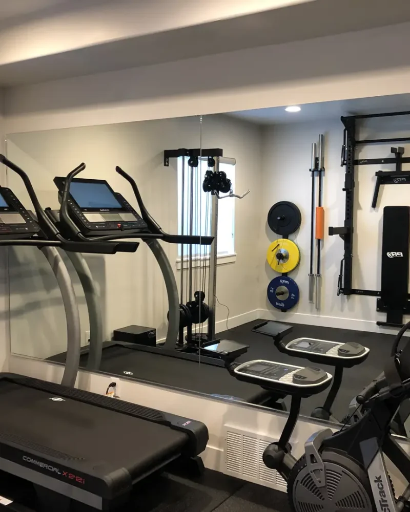 Basement Finishing Utah- a home gym with free weights and a treadmill