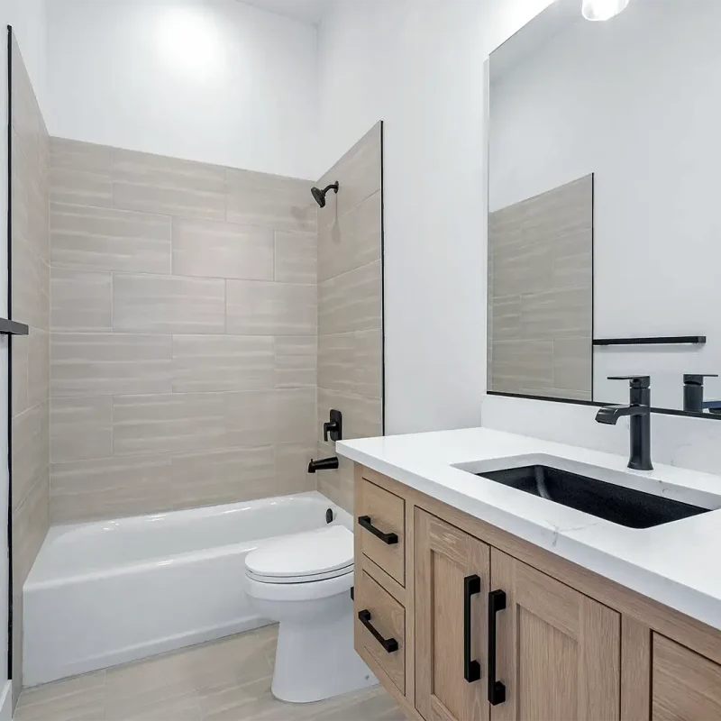 Syracuse Utah Basement Bathroom with a tile surround and a custom vanity