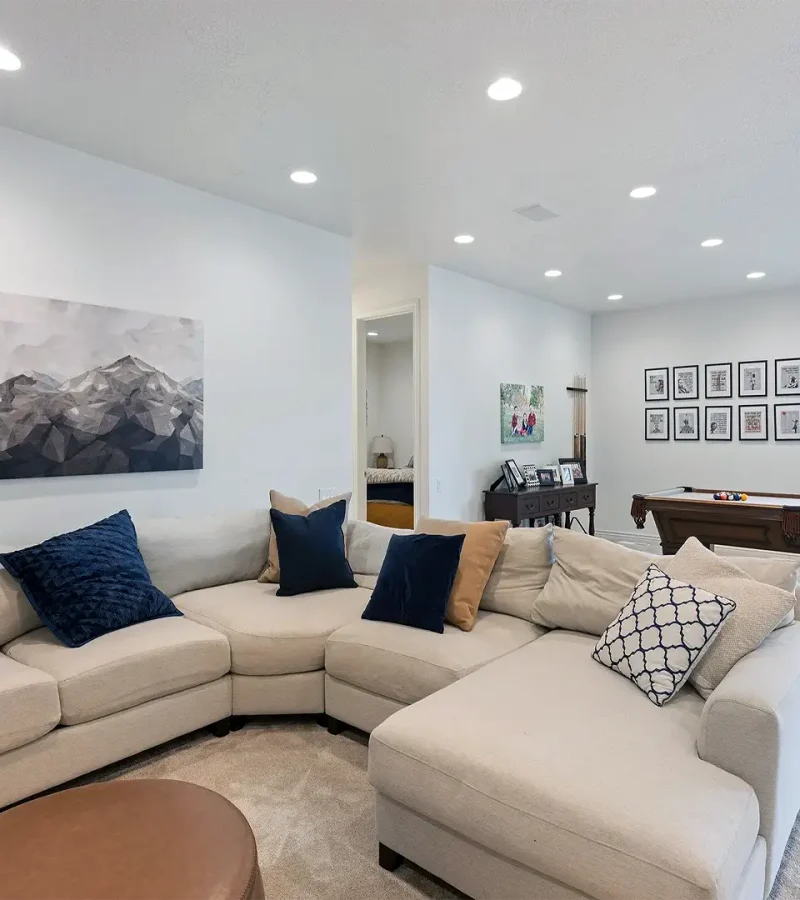 Utah Basement Finishing- family room with a large couch