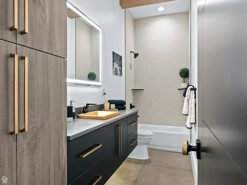 modern basement bathroom with double sink vanity and shower