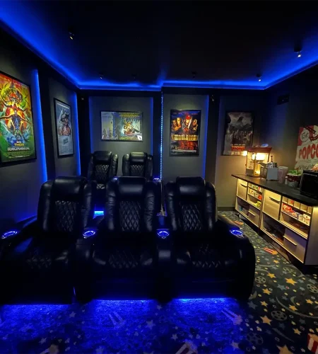 Basement Finishing Utah- a basement game room with theater seating and LED lighting