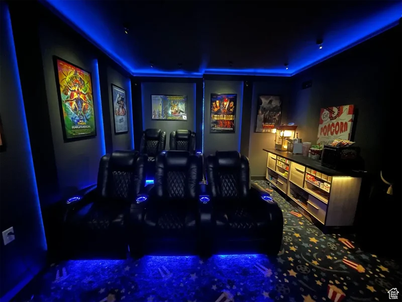 Basement Finishing Utah- a basement game room with theater seating and LED lighting