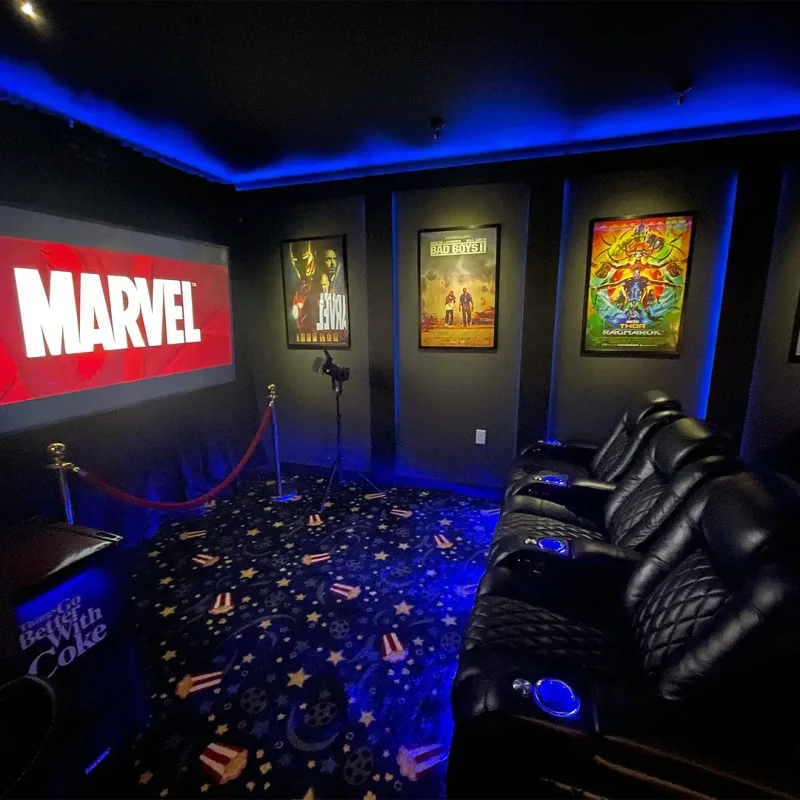 Basement Finishing Utah- custom home theater room with LED lighting and theater style seating