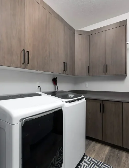 Saratoga Springs Basement Finishing- custom laundry room with cabinets