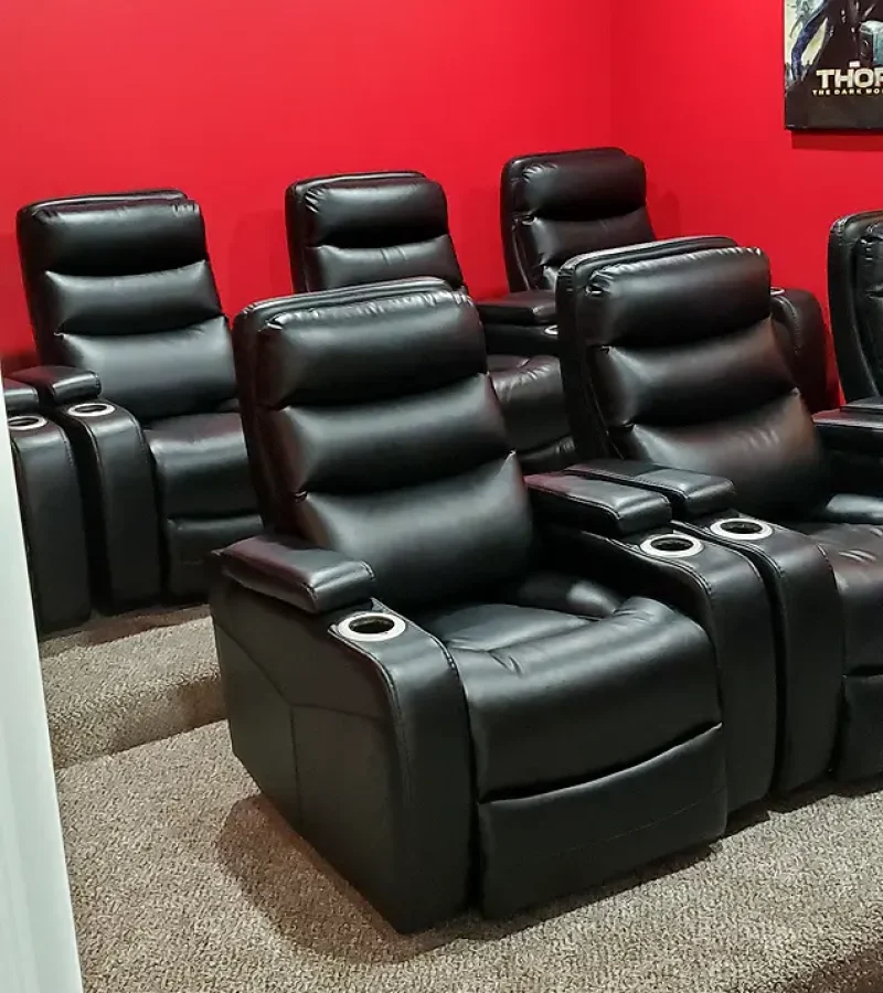 Basement Finishing Utah- basement home theater with platform seating and a red paint scheme