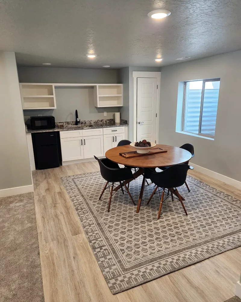 Salt Lake City Basement Finishing- nice wet bar with a serving area and LVP flooring