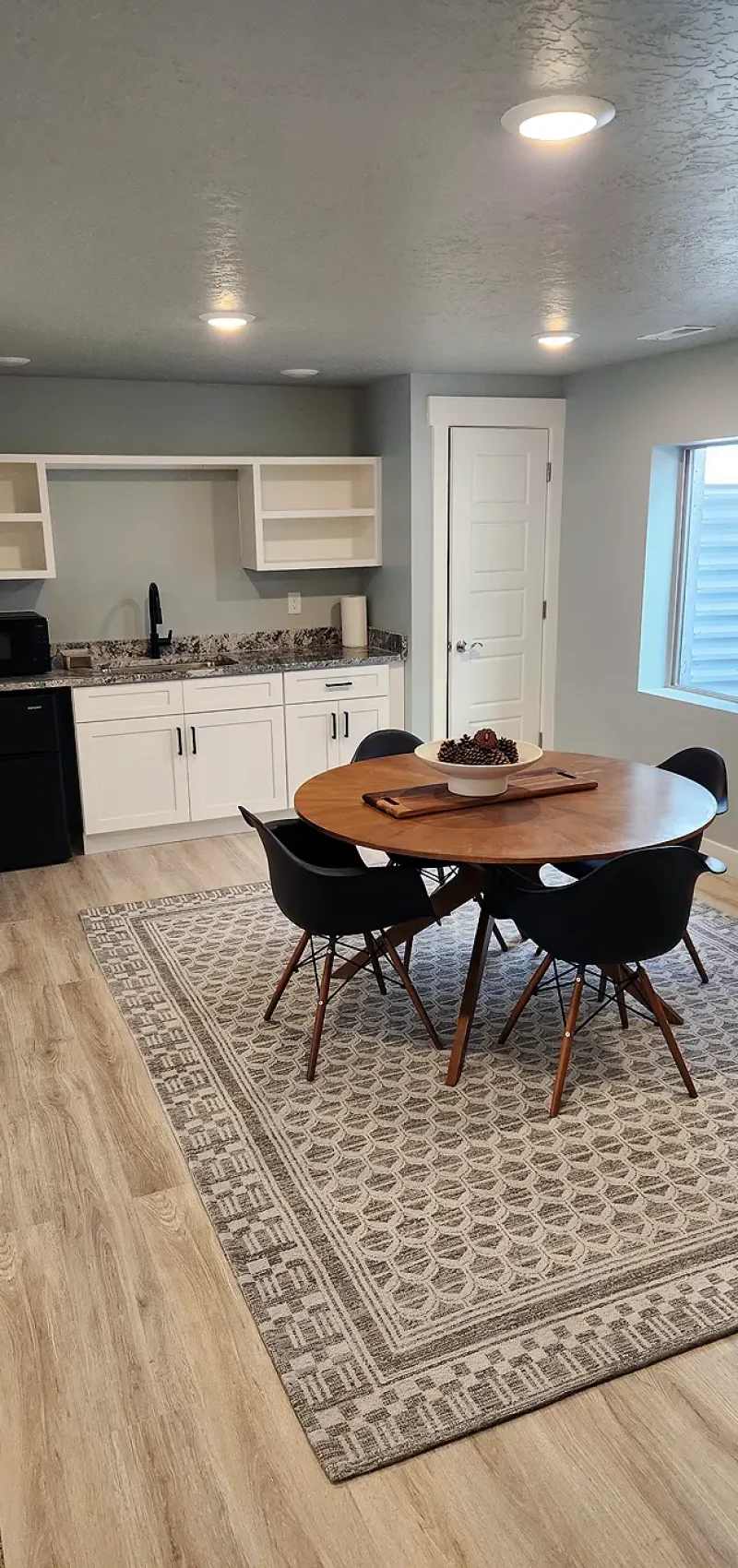 Salt Lake City Basement Finishing- nice wet bar with a serving area and LVP flooring