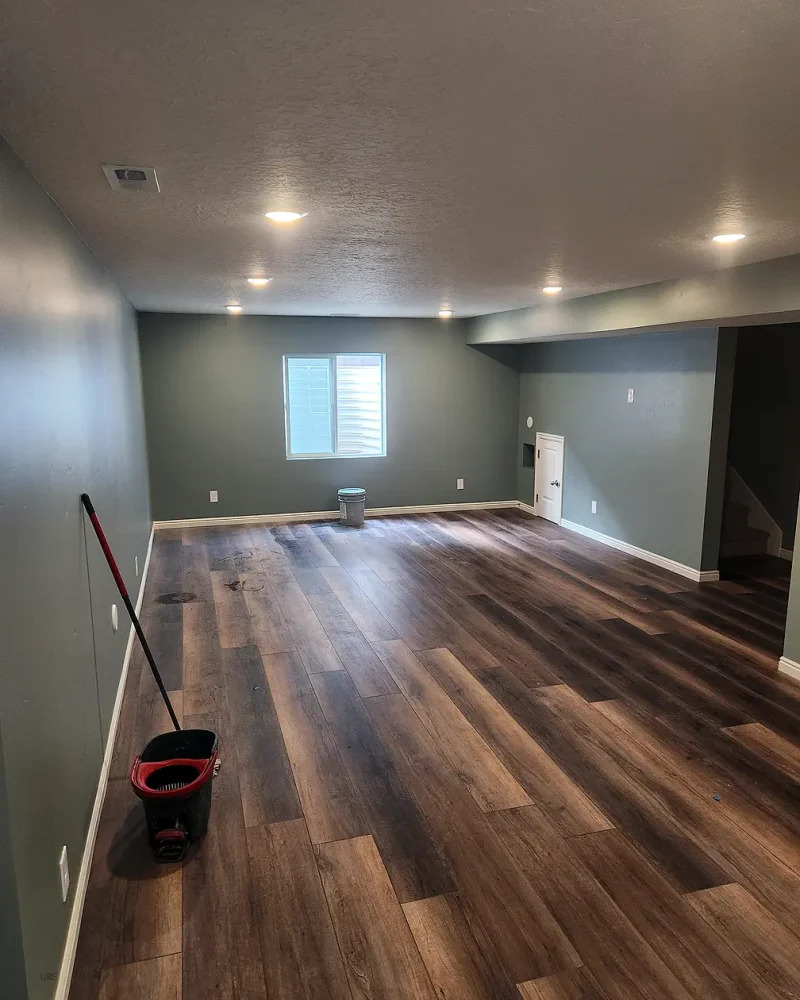 Utah Basement Finishing showing a new basement apartment with LVP flooring