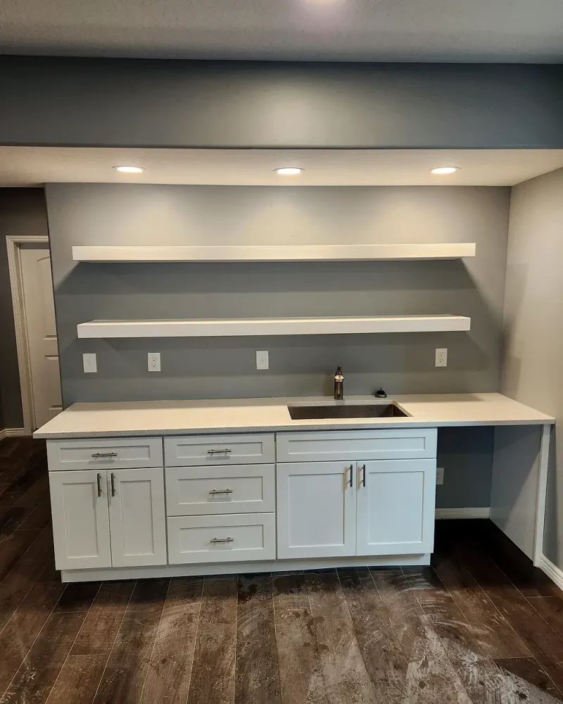 Basement Finishing Utah- a basement remodel that added a small kitchen and some floating shelves
