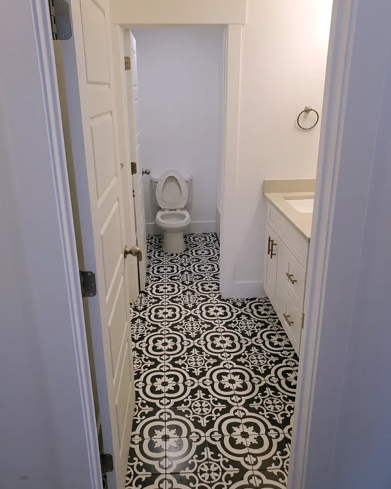 Basement Finishing Utah- basement bathroom with custom tile flooring