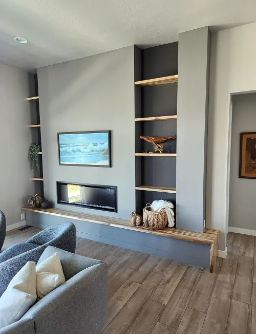 Basement Finishing Utah- custom fireplace with built in shelving