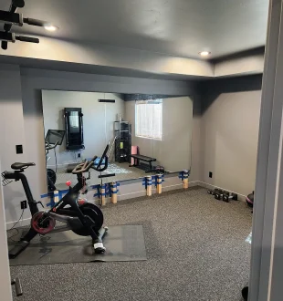Basement Finishing Utah- simple home gym with full mirrors