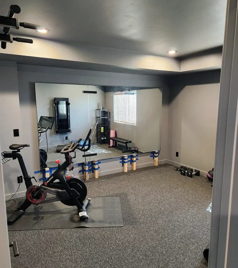 Basement Finishing Utah- simple home gym with full mirrors