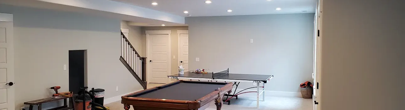 Basement Finishing Utah- a nice family room with a pool table and great lighting