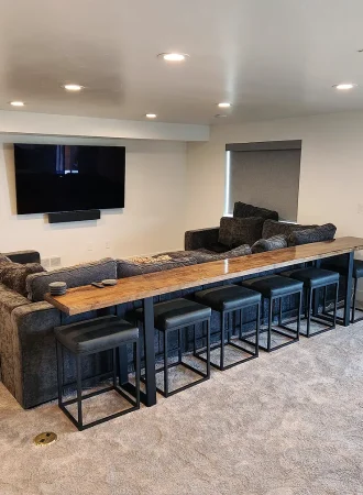 Basement finishing Utah- a basement theater room with a dry bar