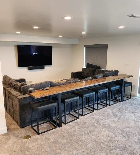 Basement finishing Utah- a basement theater room with a dry bar