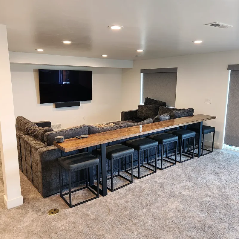 Basement finishing Utah- a basement theater room with a dry bar